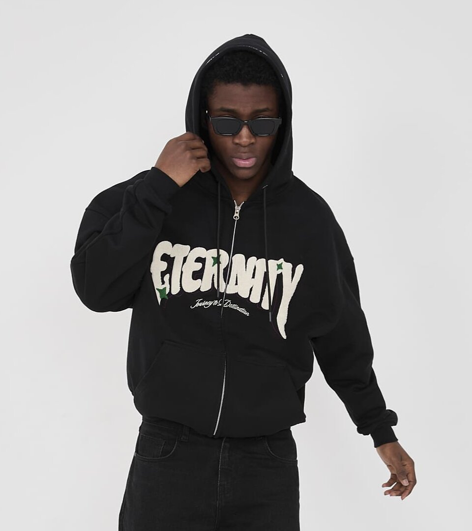 Model with hoodie and sunglasses